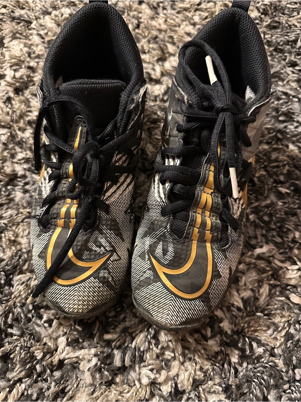 Kids Nike Black and Gold football/baseball Cleats